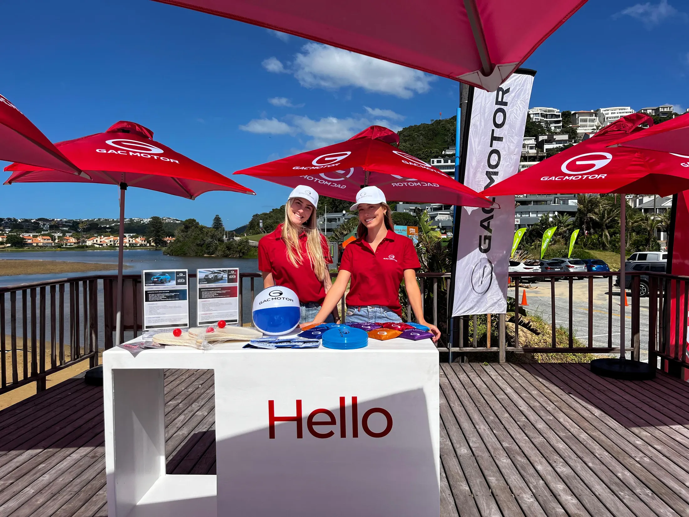 Promotional team at a branded beach stand